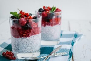 chia seeds and berries in a cup